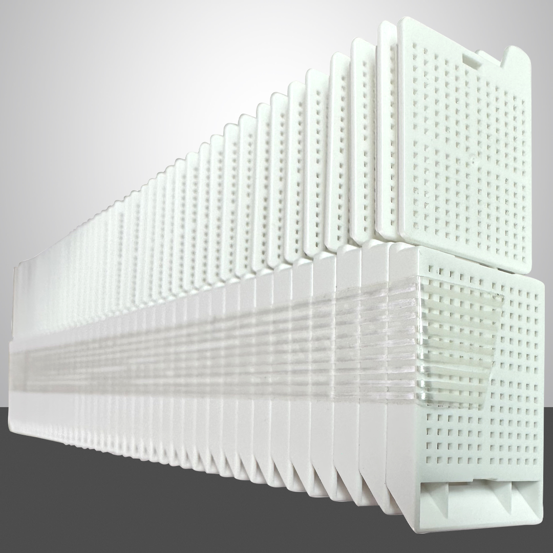 These biopsy embedding cassettes, featuring detachable lids, are conveniently taped and ready for use. White color