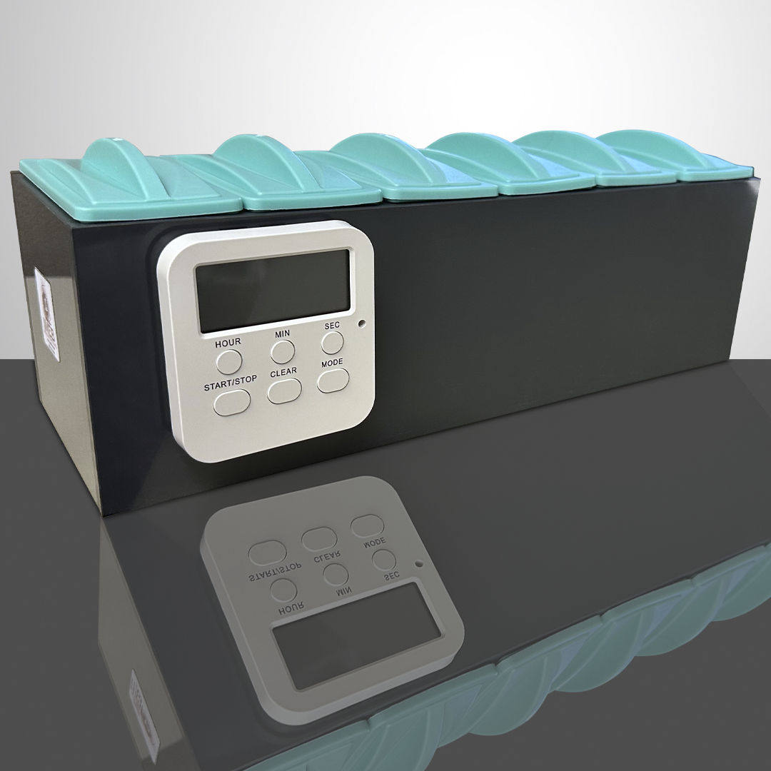 SSS-60CK slide staining rack with a digital clock on a gray table and reflection B